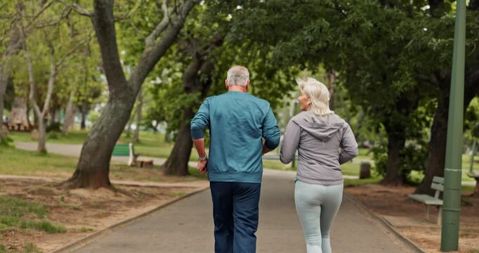 Running, park and back of senior couple for exercise, training and cardio workout together. Retirement, marriage and mature man and woman do fitness outdoors for wellness, healthy and mobility