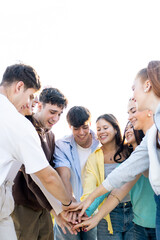 A group of 8 20-year-olds of different nationalities have fun in the streets of a city.Teenagers join hands with a sign of support and unity.Concept of youth groups in a city.