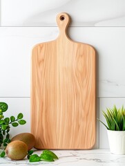 Minimalist wooden cutting board in modern kitchen setting with fresh kiwi and plants