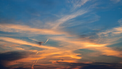 Sunset sky clouds in the evening with colorful orange, Yellow, pink and red sunlight and dramatic...