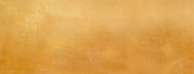 Obraz premium A warm golden textured background, providing a simple yet elegant backdrop for design or artistic projects. Panorama with copy space.