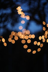 Festive backdrop fot your text or design. holiday illumination and decoration concept. Colorful defocused bokeh lights in blur night background. Defocused image.