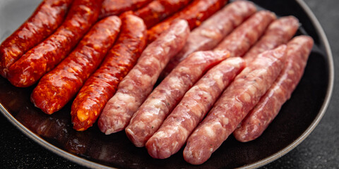 sausage raw meat beef, pork, chicken, lamb, dish fresh  gourmet food background on the table rustic...