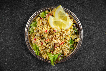 tabbouleh bulgur couscous with vegetables dish fresh delicious vegetarian and vegan food gourmet food background on the table rustic food top view copy space keto and paleo diet