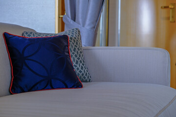 Luxurious ocean view or oceanview or outside balcony veranda cabin stateroom suite queen king double bed on luxury ocean liner cruiseship cruise ship in classic classy interior Art Deco style design