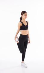 Portrait young asian woman in sportswear stretching muscle leg for health isolated white...