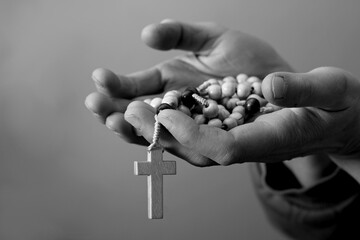 praying to god with hands together on grey background with people stock photo stock image	