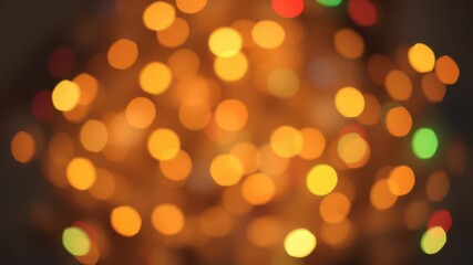 Fototapeta premium Blurred festive Christmas lights background with bokeh effect, winter, abstract, cheerful