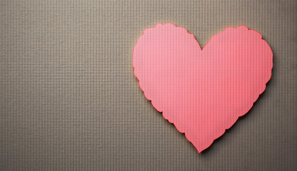 A delicate heart-shaped paper cutout against a textured wooden background