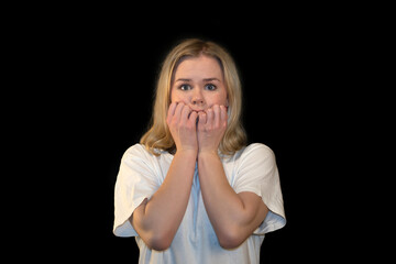 Anxious Young Woman Biting Nails with Hands Near Mouth in Fear