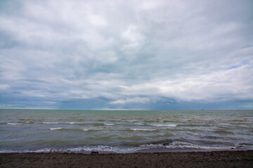 A slightly blurry picture of the vast ocean on a cloudy day