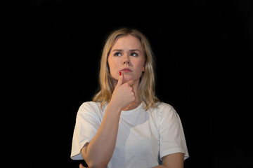 Thoughtful Young Woman Looking Away with Hand on Chin