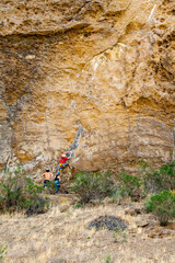 Young people doing sport climbing at canyon, piedra parada, chubut province, argentina