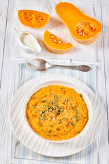butternut squash puree with pumpkin seeds in bowl