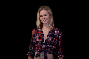 Young Woman in Casual Plaid Shirt Smiling with Confidence