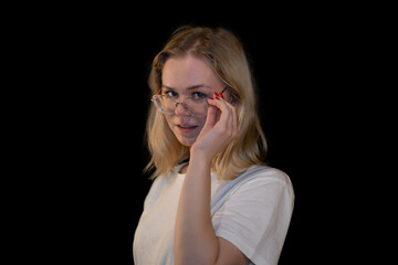 Thoughtful Young Woman with Glasses Touching Face
