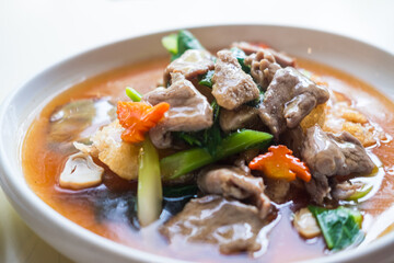 Wide rice noodles with beef or pork in gravy sauce. Healthy and tasty menu