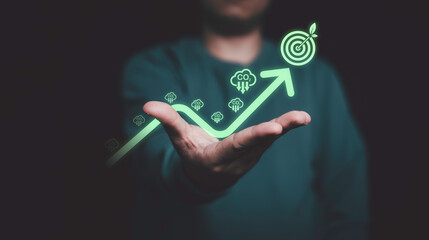 Glowing of green up arrow with carbon reduction on businessman until achievement environment target for decrease CO2 , carbon footprint and carbon credit to limit global warming from climate change.