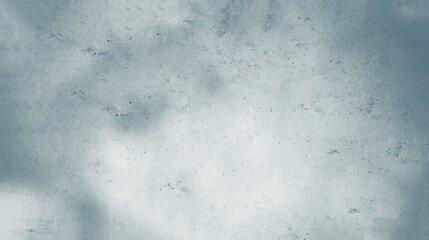 The texture of the background of a rough mottled gray concrete wall