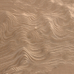 Rough brown wavy surface of the background texture