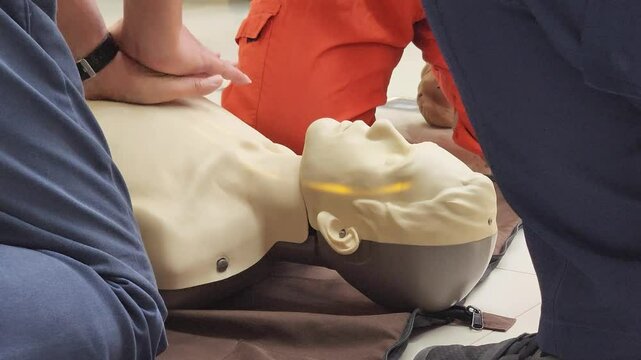 CPR practicing on the human manikin or dummy model. Medical and emergency rescue training in action, 4k footage.