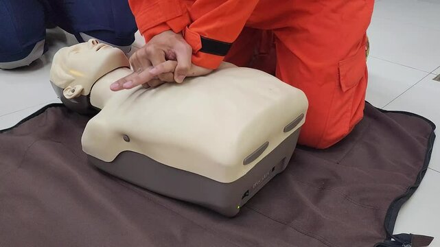 CPR practicing on the human manikin or dummy model. Medical and emergency rescue training in action, 4k footage.