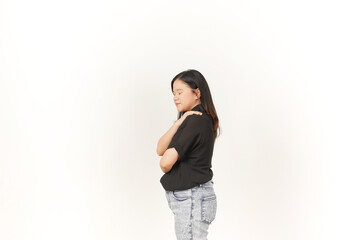 beautiful Asian woman places her hand gently on her chest, expressing sincerity or gratitude,...