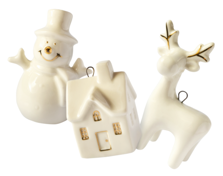 Christmas holliday image, Christmas bauble in shape of a white deer, house and snowman falling in the air isolated on white background