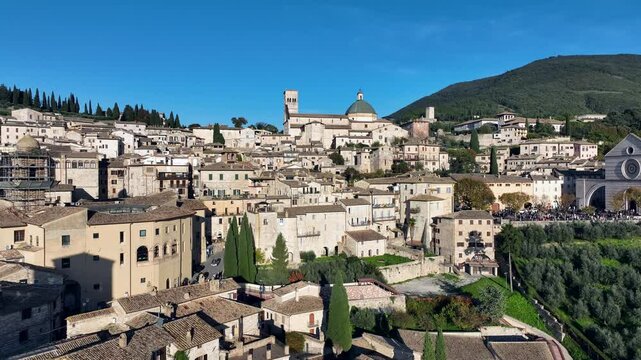 The city of Assisi, Umbria, Italy. Tourist destination of pilgrimage.
Aerial view of Assisi, religious center of Italy. Skyline of the monumental, historical and romantic city.