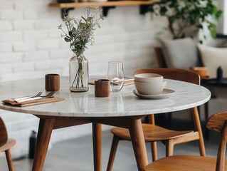 Round marble and teak dining table, midcentury interior, warm light, cozy setup