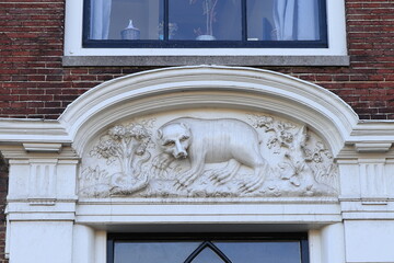 Historic White Sculpted Tablet Depicting a Bear and an Adder in Haarlem, Netherlands