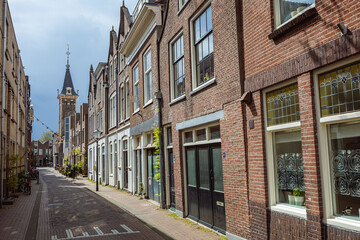 Fototapeta premium Street in Historical City Centre with Old houses, Gouda, Netherlands