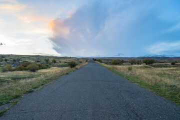 Asphalt road, travel concept, fields all around