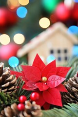 Obraz premium Festive Christmas decoration with poinsettia pine cones