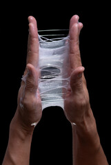 Test for sticky cosmetic lotion or gel against a black background