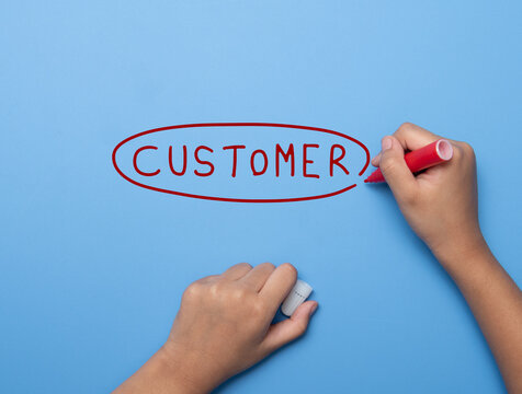 Hand writing CUSTOMER with marker, concept background