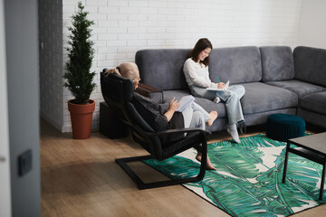 Schoolgirl girl at a psychological session with a child psychotherapist in a cozy office