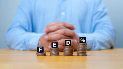 The Federal Reserve to control interest rates. FED concept. Wooden blocks FED. American economy and...
