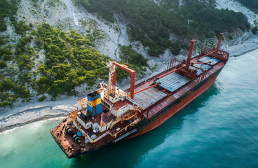 Aerial view of an abandoned bulk-carrier dry cargo ship washed ashore after a storm