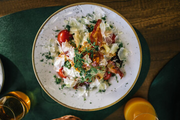 Caesar salad with cherry tomato, bread and cheese.