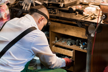 A Craftsman Organizing Tools in a Workshop with Precision