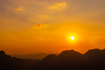 Mountain landscape with amazing colorful sunset in Vang Vieng Laos.