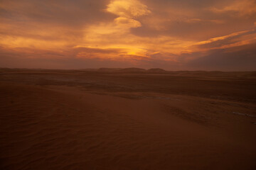 scenic view of desert dune during sunset