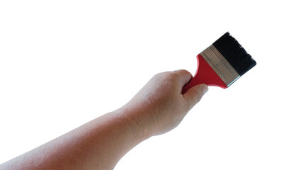 Red paint brush in hand on white background.