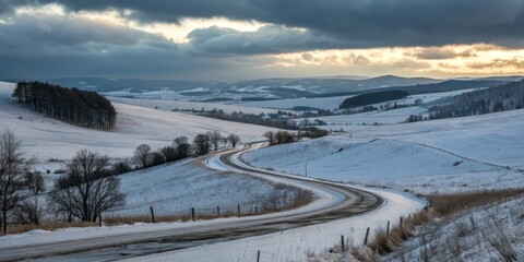 Softly Undulating Hills Against a Muted Gray-Blue Cloud-Laden Sky in Tranquil Natural Landscape