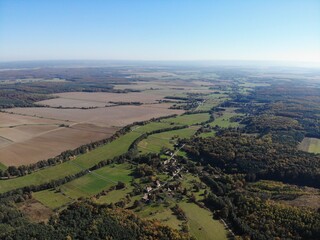 A photo of a view of a rural area with a small town