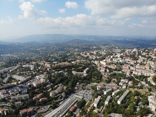 Obraz premium A photo of a city with a lot of buildings and a lot of trees
