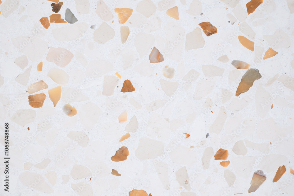 Poster A white background with a lot of small rocks scattered around it. The rocks are of different sizes and colors, creating a textured and visually interesting surface