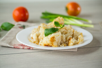 Diet boiled cauliflower fried in oil with spices