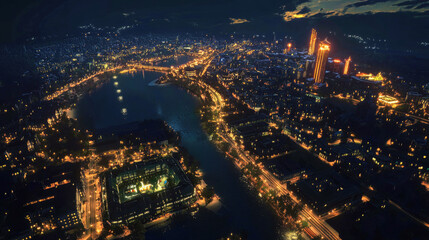 Naklejka premium Aerial view of a vibrant city at night with glowing streets and bright skyscrapers